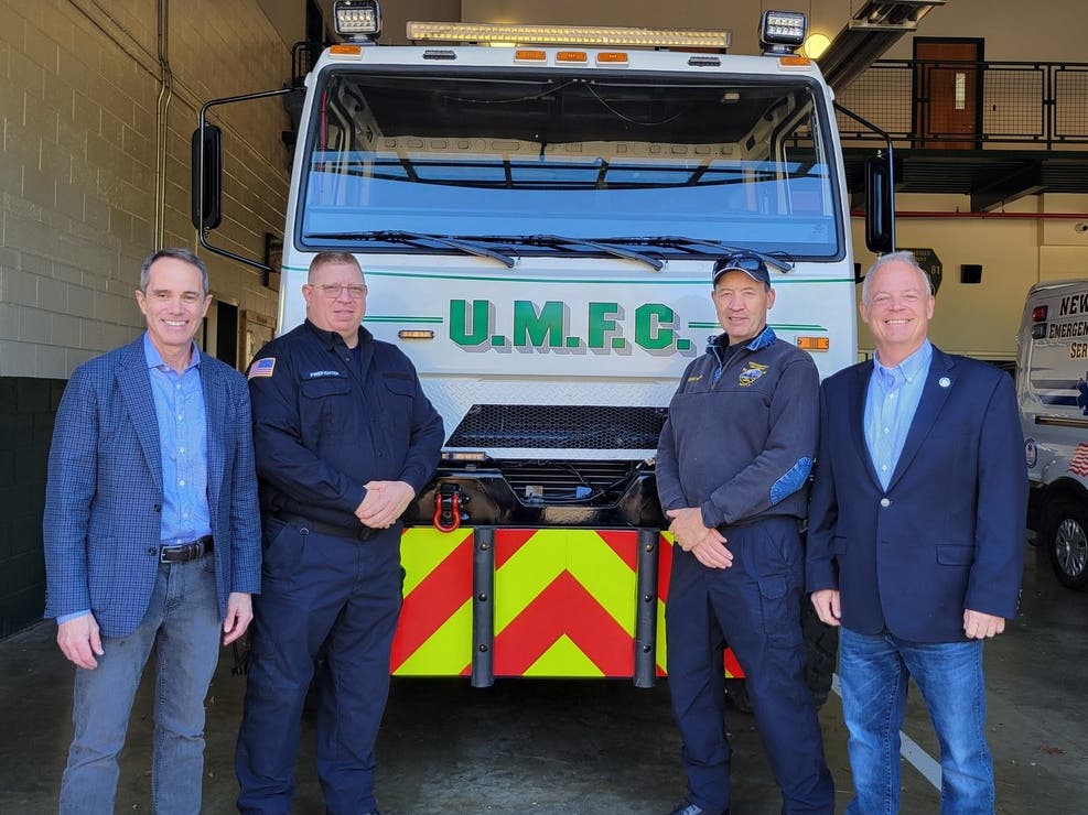 State Senator Steve Santarsiero, left, and State Rep. Perry Warren, right, announce a $103,000 state grant for the Upper Makefield Fire Company.