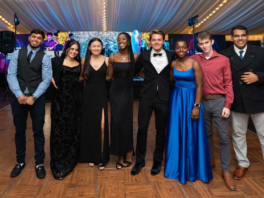 In between dancing, Bucks County Community College students gather for a group photo at the first Celebrating Student Success Gala in 2022.