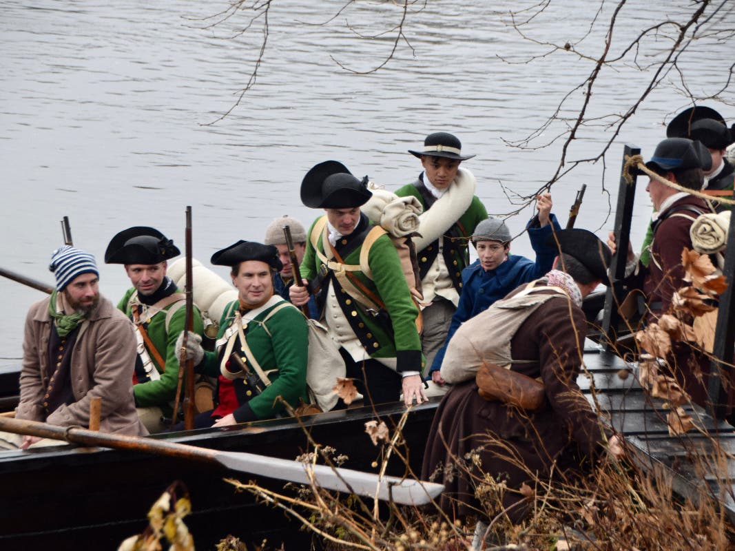 The troops land in New Jersey during a re-enactment of Washington Crossing the Delaware.
