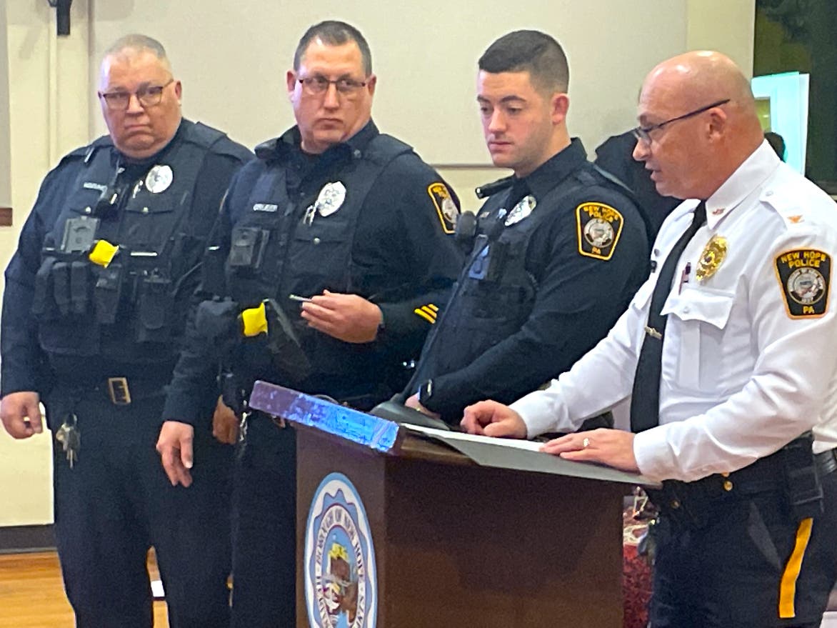 Chief Kevin Edwards recognizes the life-saving efforts of Officers Austin McLeod, Steve Gruber, and Ken Kozukowski.