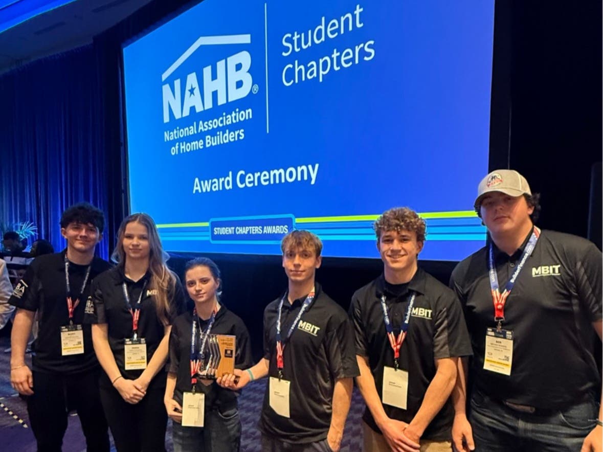 MBIT students with their Rookie of the Year award.