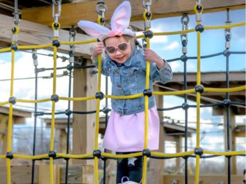 A youngster climbs the ropes during Shady Brook Farm's Easter Eggstravaganza.