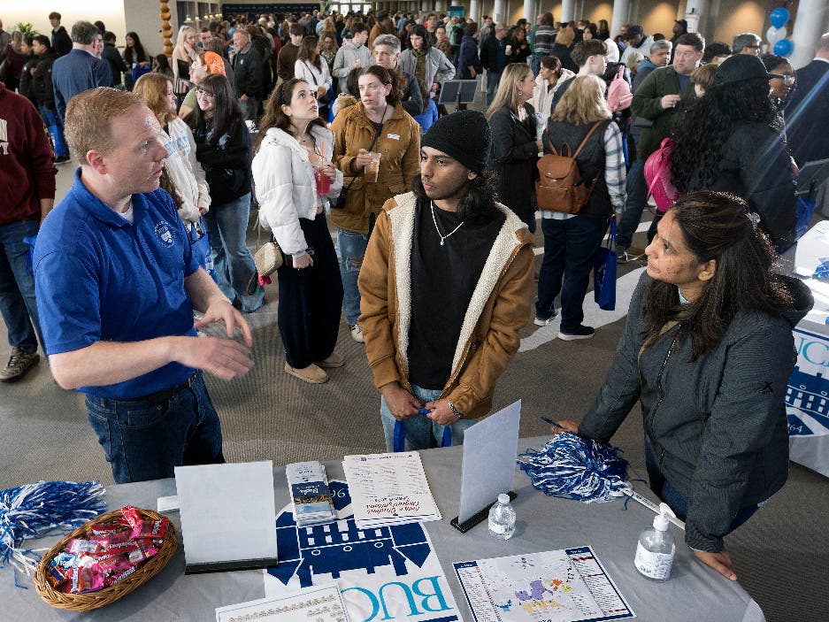 Chris Seifert, director of student engagement at Bucks County Community College,
explains the leadership opportunities and other ways to get involved to prospective
students during a recent open house.
			