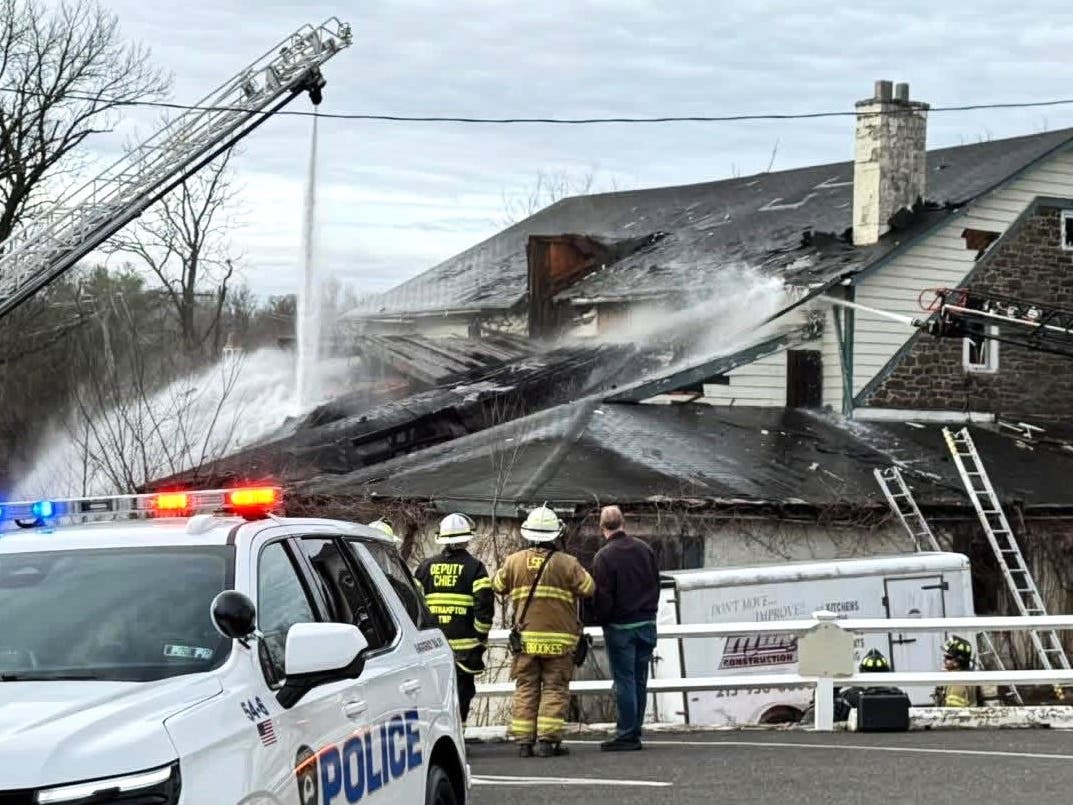 Firefighters at the fire scene in late March.