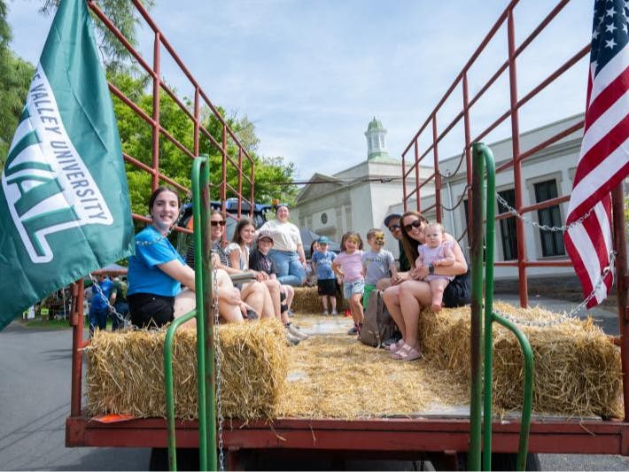 A-Day visitors enjoy a hayride on campus.