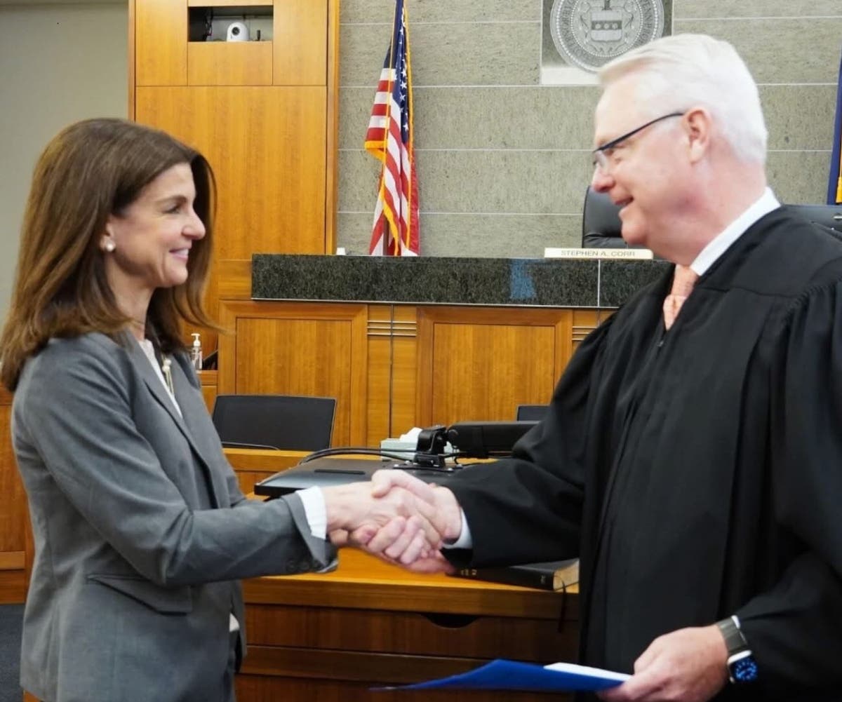 Dr. Joanna Wexler is congratulated by the Honorable Judge Steven Corr after taking the oath of office.