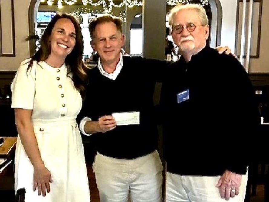 Club co-presidents Amanda Benolken and Harry Boertzel present Lambertville Mayor Andrew Nowick with a $500 check in support of the Lambertville Farmer’s Market. 