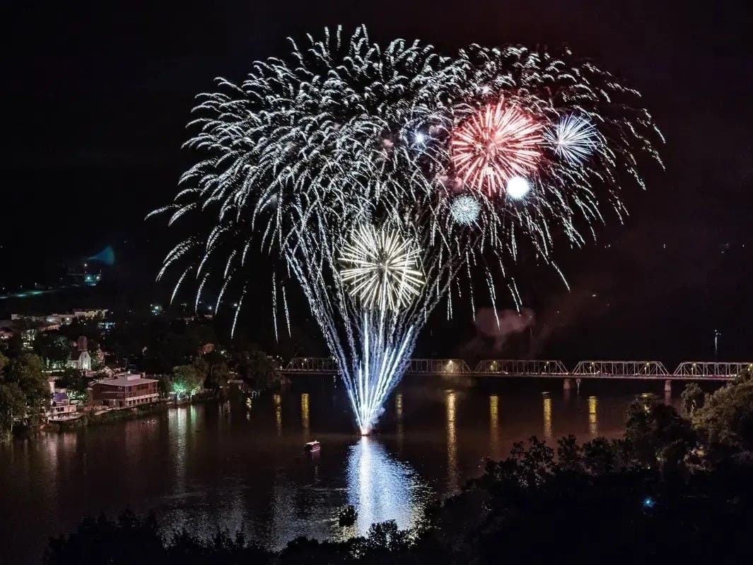 Fireworks explode over the Delaware River between New Hope and Lambertville.
