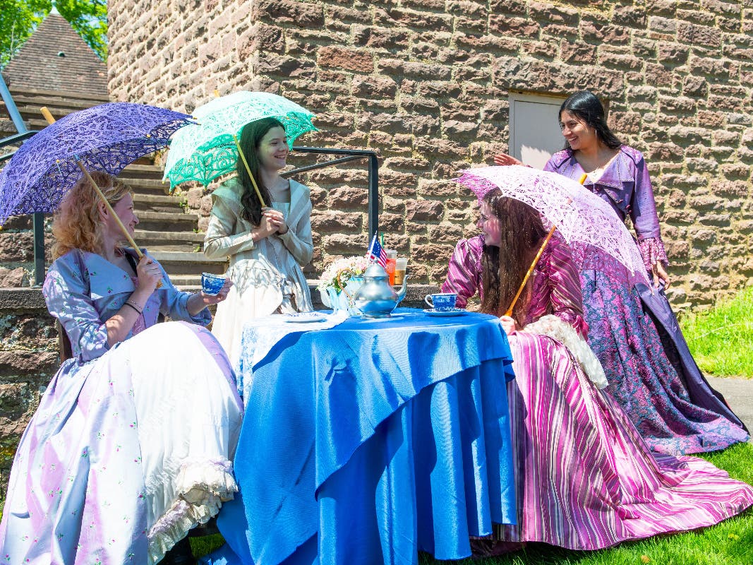 Guests arriving at Bucks County Community College’s Salute to Mothers Scholarship
Tea were greeted by students in colonial costumes – courtesy of Bristol
Riverside Theatre - in homage to America’s founding mothers. 