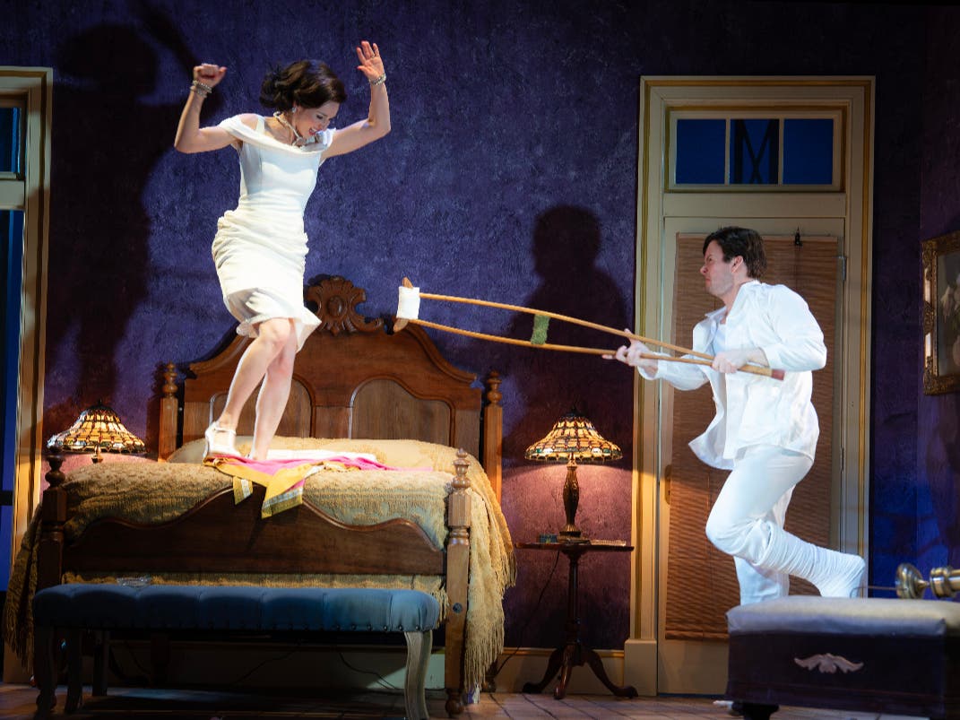 Elizabeth A. Davis as Maggie and Lucas Dixon as Brick in Tennessee Williams’ “Cat on a Hot Tin Roof” at Bucks County Playhouse through May 23.