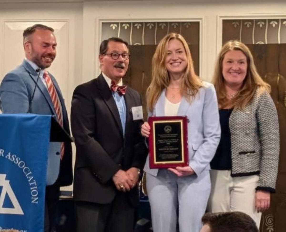 Bucks County First Assistant District Attorney Kristin M. McElroy accepting the 2026 Eugene Vittone Minister of Justice Award.