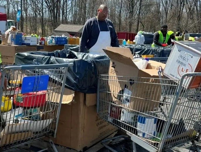 A worker sorts through some of the hazardous waste dropped off at a recent collection drive.