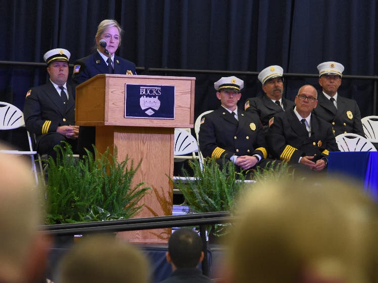 Tracie Young-Brungard of the Pennsylvania Office of the State Fire Commissioner
delivers the keynote address to 46 volunteer firefighters who received their national
certification from Bucks County Community College at a May 19 ceremony.