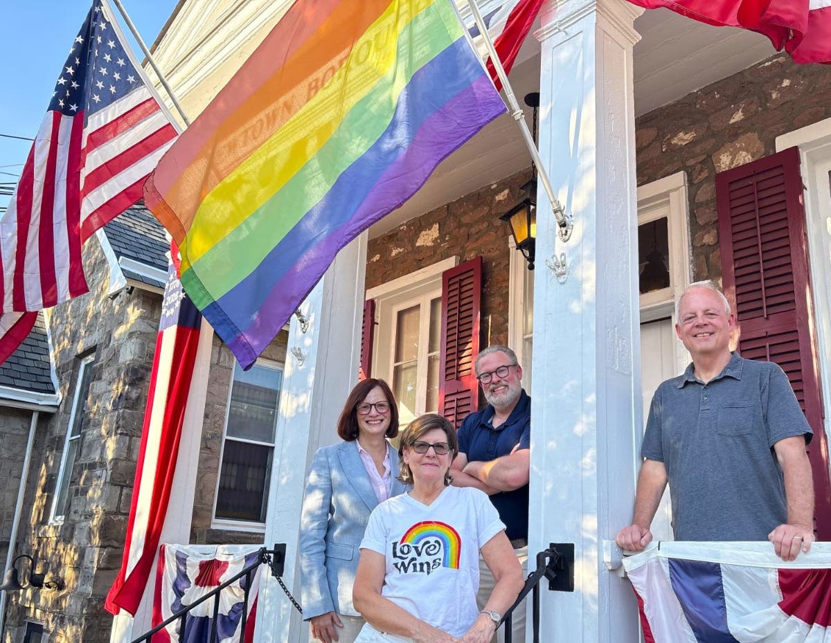 Raising the Pride flag at the Newtown Borough Hall are, from left, Mayor Tara Grunde-McLaughlin, Barbara Simmons, Councllman Josh Phillips and State Rep. Perry Warren.