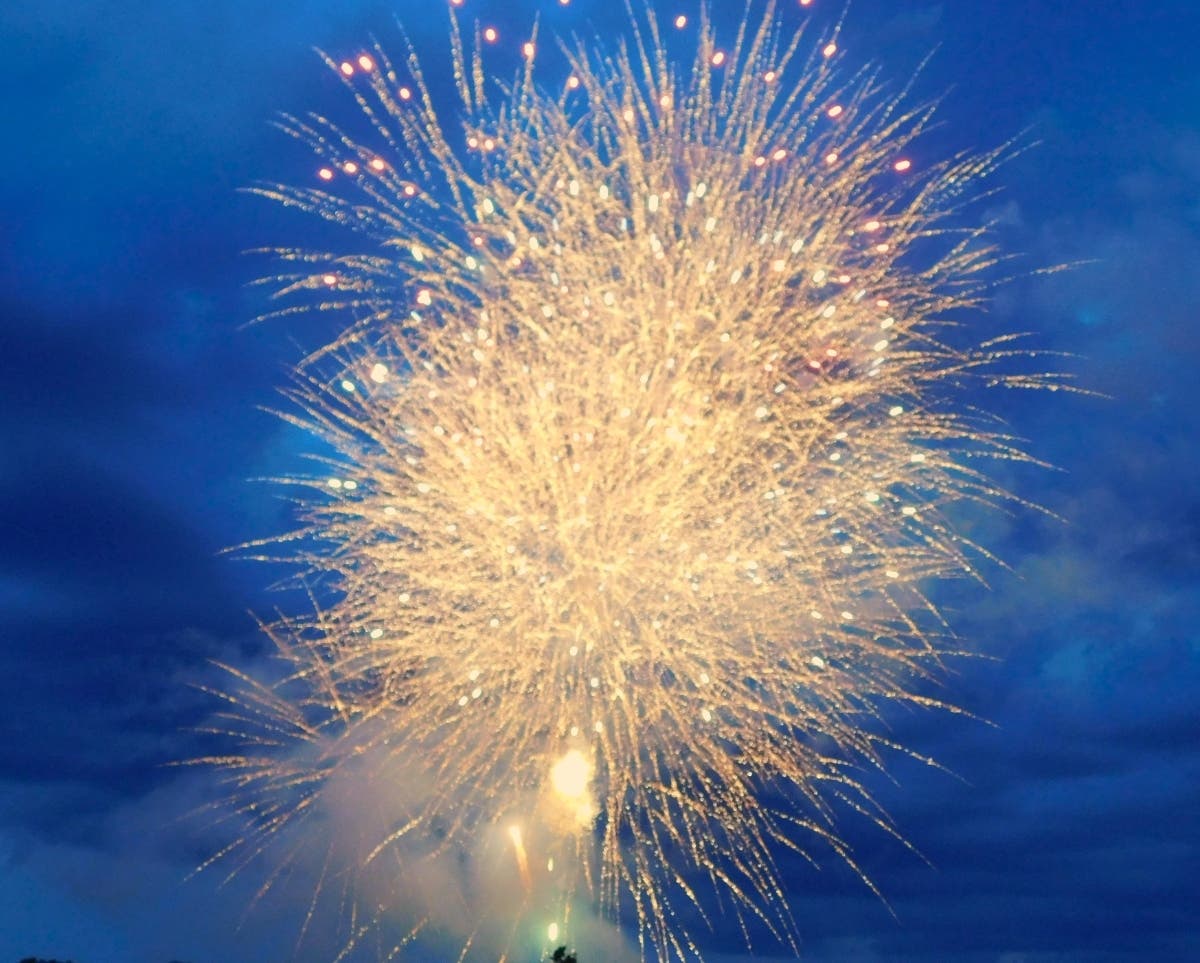 Fireworks explode over the Delaware River at Washington Crossing.