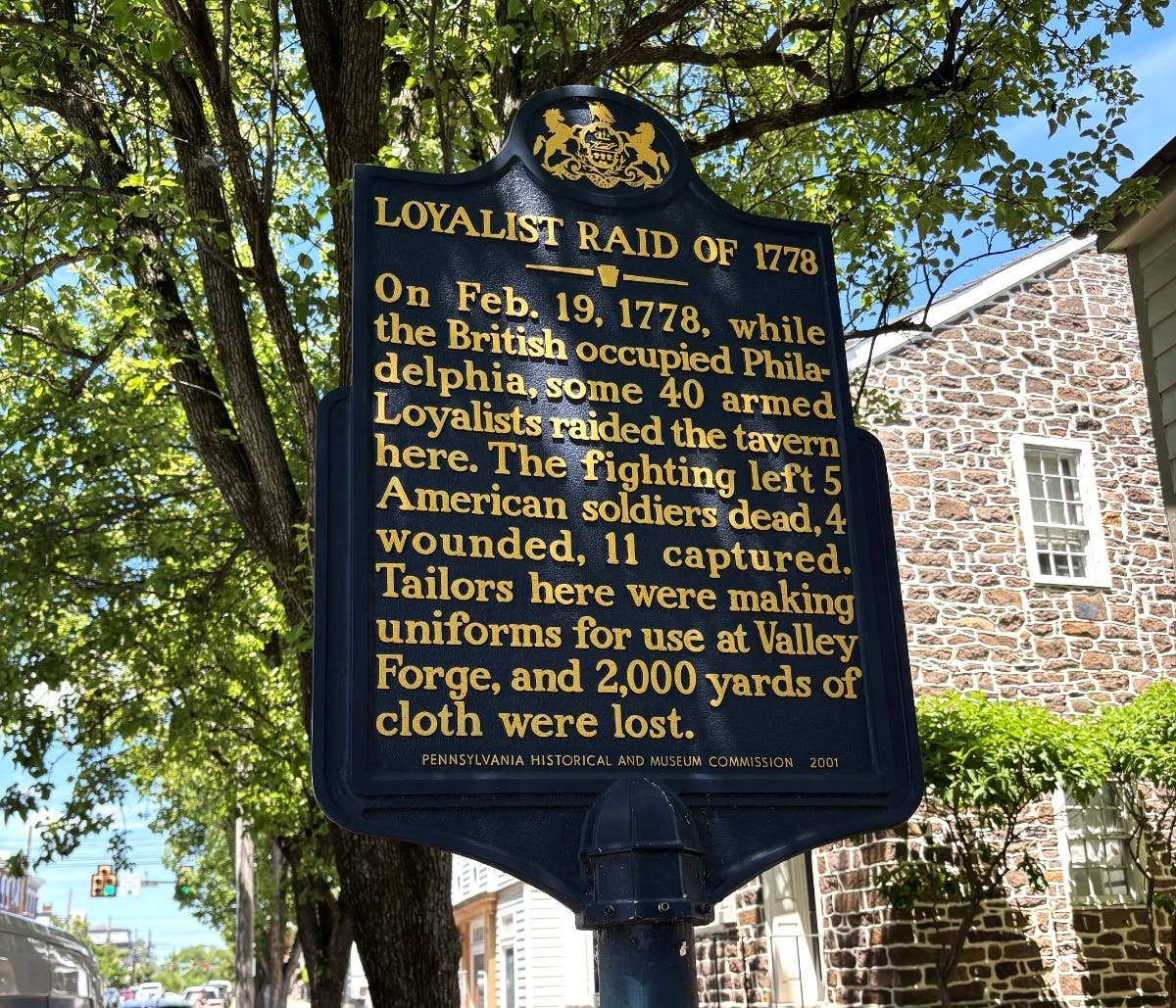 A sign marking the site of a Loyalist raid at the BIrd-In-Hand.
