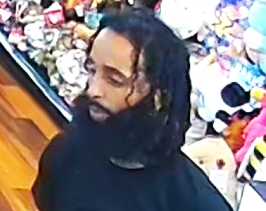 An arrest warrant has been issued for this man for passing counterfeit currency in Newtown.