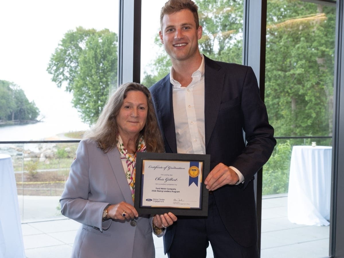 Chris Gilbert with Fred Beans Ford is congratulated on completing the Ford Rising Leaders Program by Elena Ford, Chief Dealer Engagement Officer, with the Ford Motor Company.
