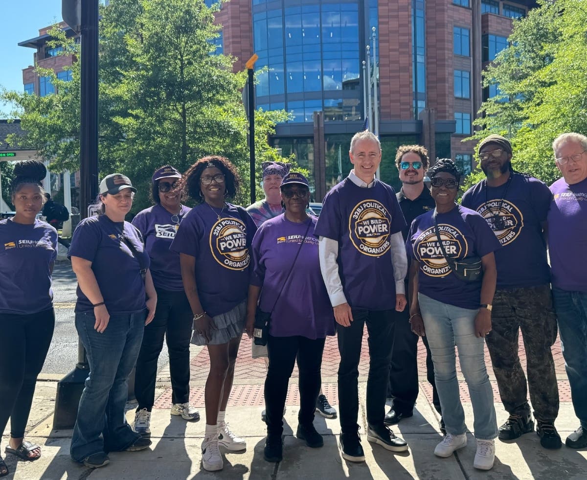 Members of SEIU Local 668 standing with Congressman Brian Fitzpatrick in front of the Bucks County Justice Center in Doylestown.