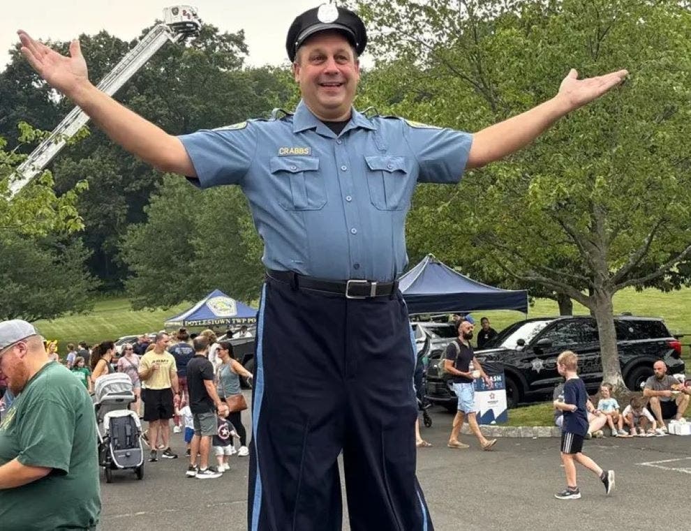 A nine-foot-tall "police man" walks the beat at National Night Out 2025 in Doylestown Township. (Jeff Werner/Patch)



