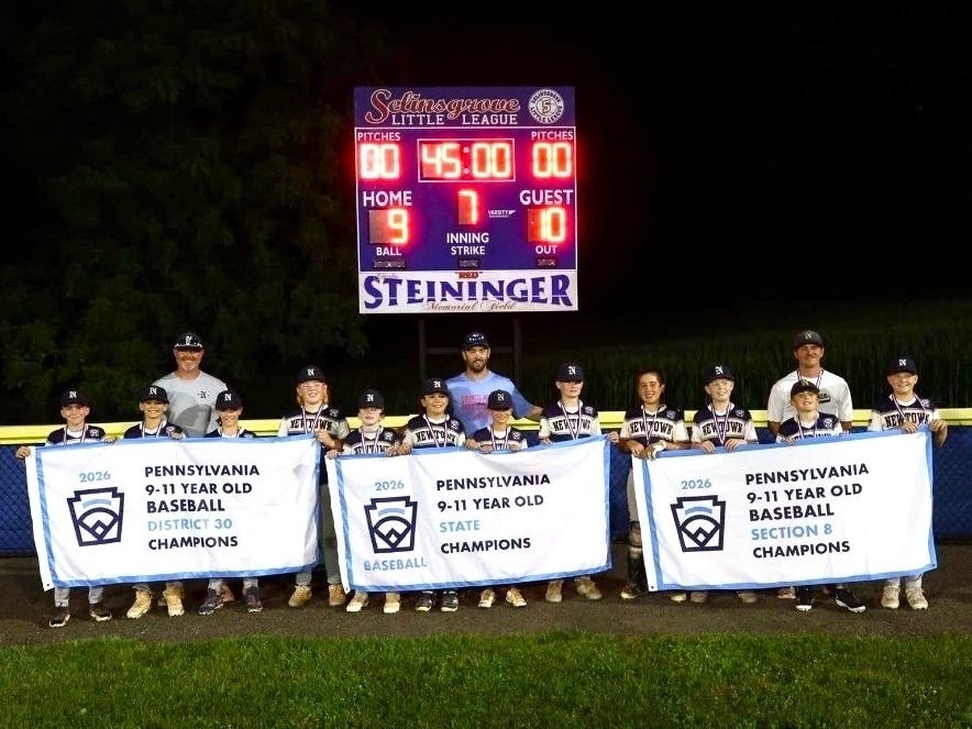 The team with their championship banners.