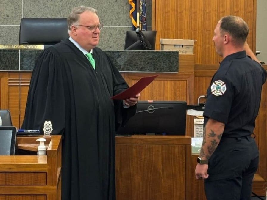 Harley Turner is sworn in as the township's newest career firefighter by the Honorable Judge Jeffery G. Trauger.