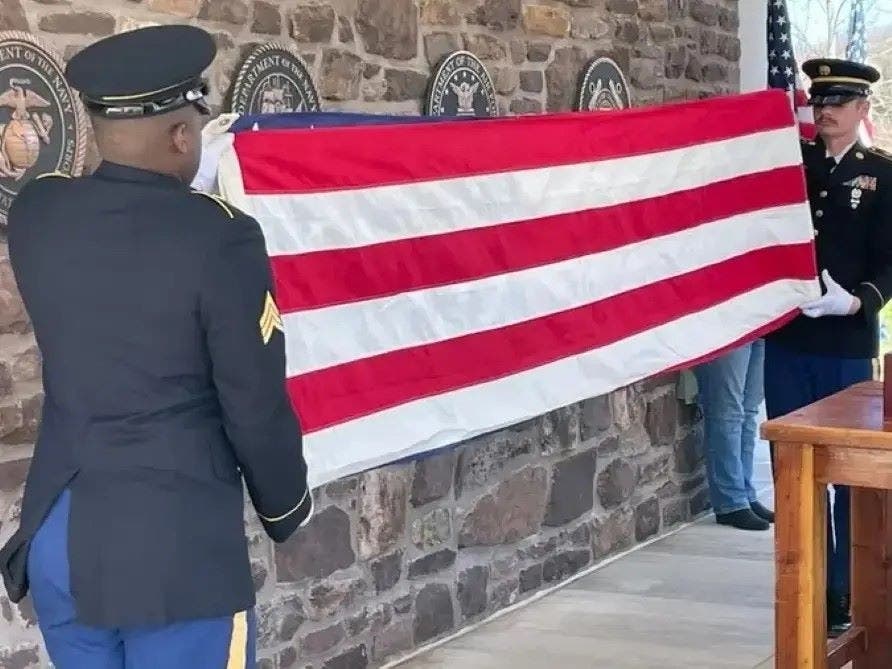 Rendering honors during an Unaccompanied Veterans service.