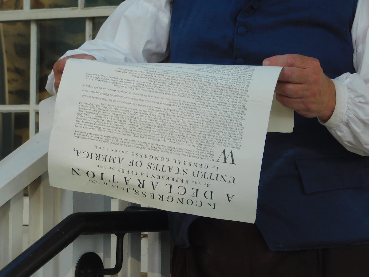 A re-enactor reads the Declaration of Independence during a Fourth of July celebration at Washington Crossing Historic Park in July.