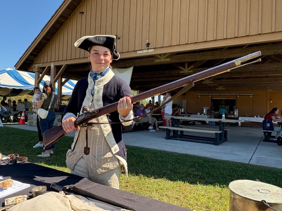 A re-enactor shows off his musket during last year's event.