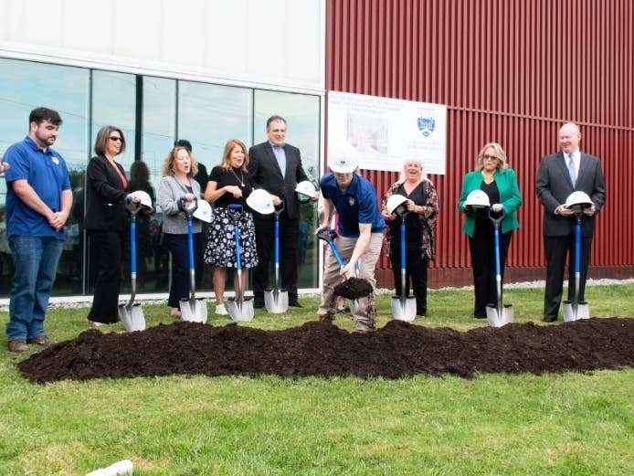 Bucks County Community College Building and Construction Trades graduate Tim
McCloud puts the first shovel in the dirt at the September 18 groundbreaking ceremony
for a new HVAC lab at the College’s Center for Advanced Technologies in Bristol.