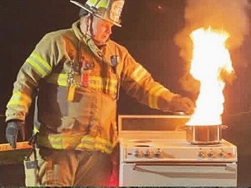 A Lingohocken firefighter leads a kitchen fire demonstration.