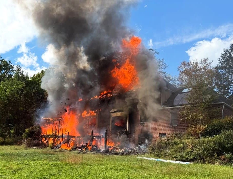 Fire engulfs a home on Tall Oaks Lane in Newtown Township in early October.