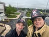 Lt. Jason Raschke and Firefighter Hugh Jordan III are in a bucket high above a fire training session.