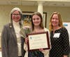 Danielle Carradorini accepts the Violet Richardson Community Service Award from Jenny Lichtner, SIIR president, with her mother, Carolyn.