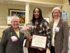 Deanna Bembury accepts the Live Your Dream Award from Jenny Lichtner, SIIR president, and Marlene Piasecki, Past President.