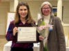 Dr. Samantha Gross accepts the Advancing the Status of Women Award for Bucks County Community College from Jenny Lichtner, SIIR president.