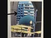 Take a look at the "large" building through the Rowes Wharf Arch.  That building sits many hundreds of yards away, across the harbor.  This can be seen from the corner of Surface Road and Broad Street, during the day. 
