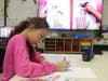 A young artist hard at work during Roosevelt Elementary's After School Art Club.