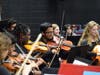 Orchestrating Excellence: Students from Ossining High School captivate the audience with their musical prowess during the First Annual White Plains Orchestra Festival.