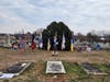 Lineup of flags and wreaths with master of Ceremonies Tom Hamill,  Culpeper Minutemen Chapter.  John Champe wreath 2nd from right,  John Champe Flag 1st on right
