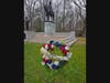 The Sgt Maj John Champe wreath in front of a statue of Major General Nathanial Greene at The site of the Battle of Guilford Courthouse
