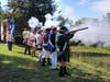 Musket volley.  Fire Squad commander Mark Sink, SMJC Chapter on far left