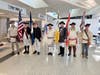 The Sons of the American Revolution color guard inside the terminal. L-R; Richard Tyler, Paul Christensen, Barry Schwoerer, Chip Daniel, Jim Cordes, Allen Phillips, Mark Sink