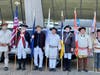 The SAR color Guard outside the terminal prepared to present colors as buses with Veterans pass by. L-R:  Richard Tyler, Paul Christensen, Barry Schwoerer, Dale Corey, Jim Cordes, Allen Phillips, Mark Sink