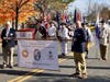 The Col. William Grayson Color Guard.  Front with banner L-R: Jeff Sterling, Mike Wilson.  Back of Banner:  Color Guard Commander Andrew Mills, Bill Groff, Ray Hawkins, John Huddleston, Mel Hurley.  Sgt Maj John Champe float in background