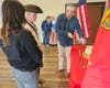USMC Birthday Cake cutting.   L-R:  SSGT Caitlin  Gedney-Ray, Mark Sink, Captain William Gazes.
