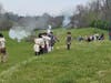 Militia firing muskets to recreate the battle of Lexington