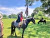U.S. Light Dragoons reenactor with reproduction of the Battle Flag used by Light Horse Harry Lee