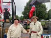 L-R:  Warner Workman, Barry Schwoerer in front of the float with replica Liberty bell in background
