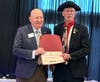 SMJC member Richard Ryan accepting a certificate of Patriotic Service as an event volunteer from Loudoun County Treasurer Henry C. Eickelberg